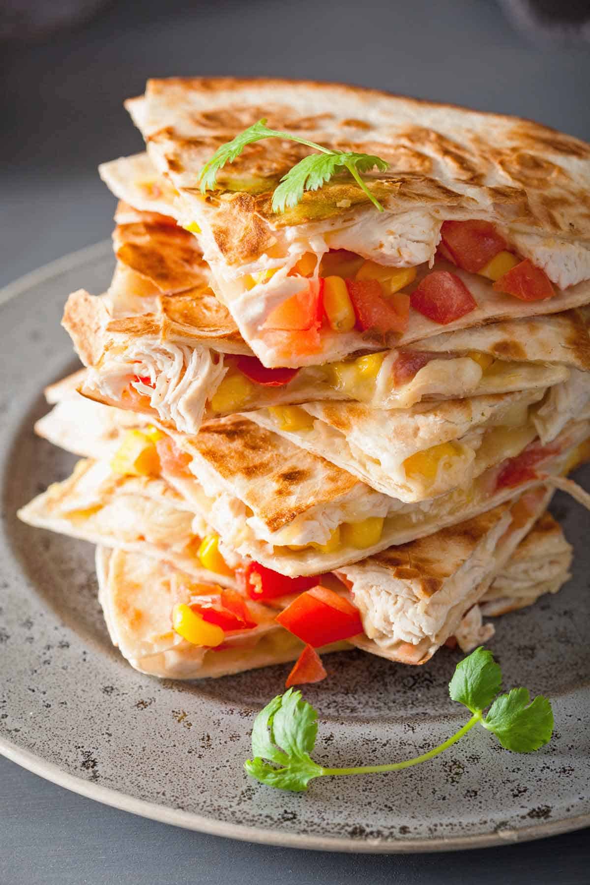 Stack of chicken quesadilla wedges.