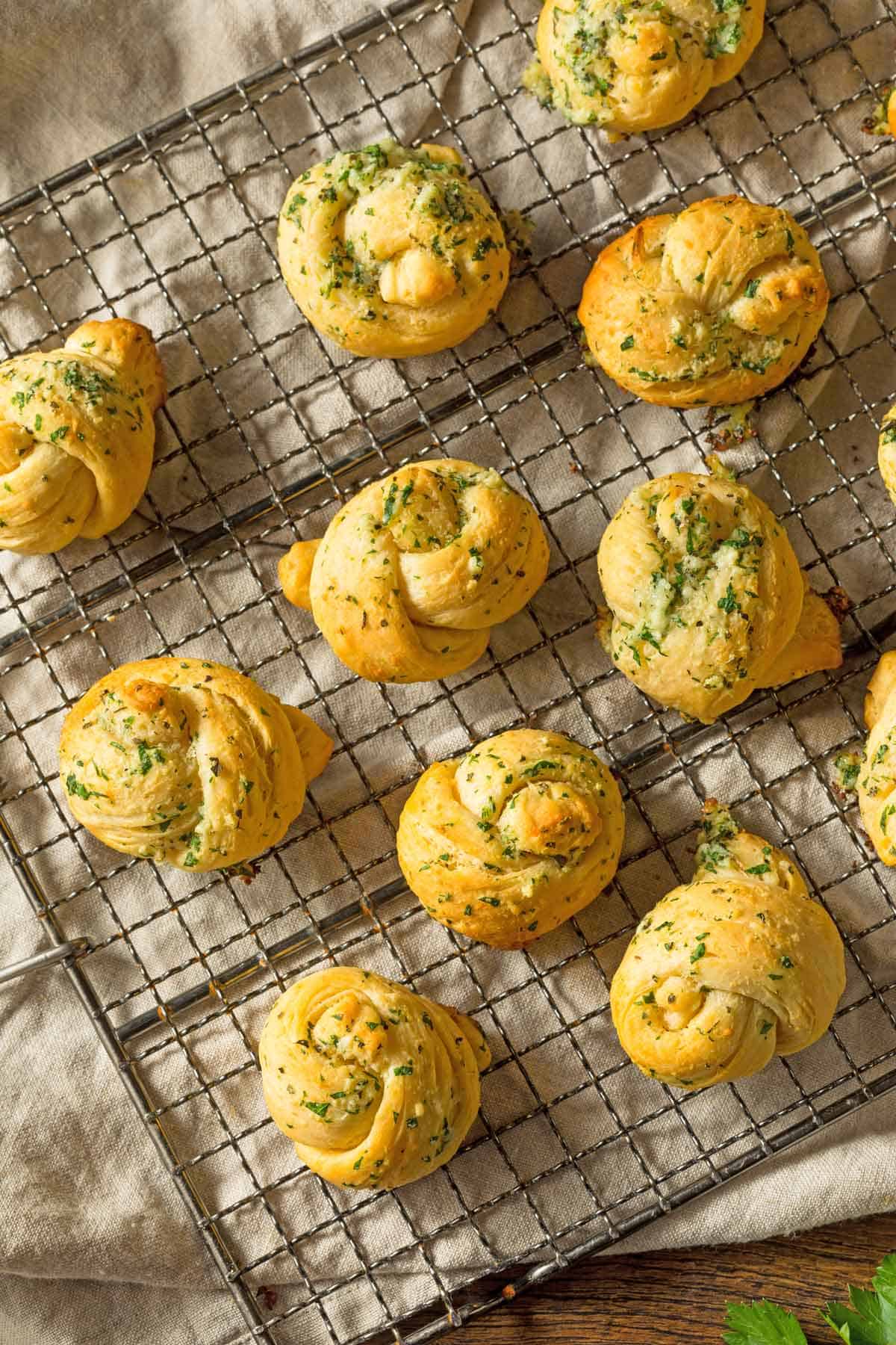 Garlic knots on a cooling tray.