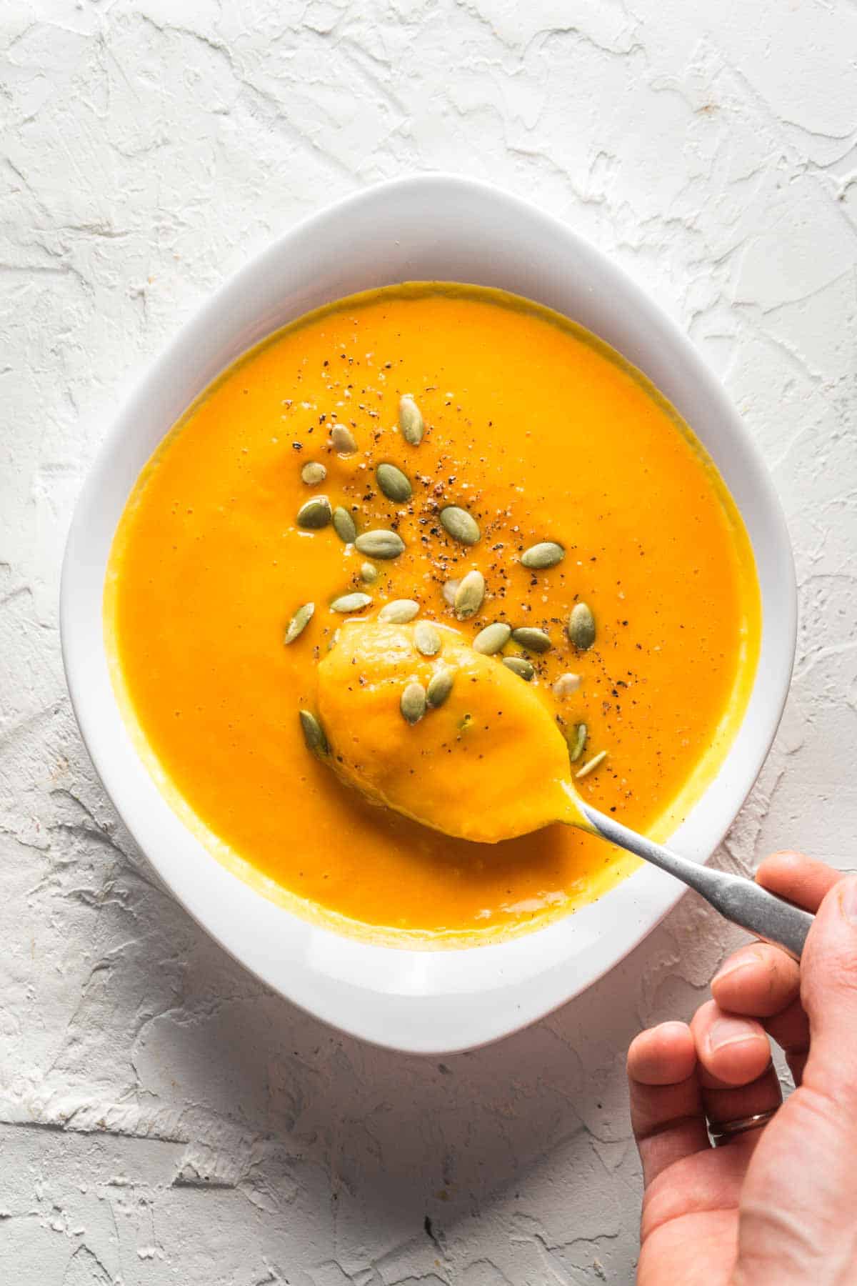 A bowl of pumpkin soup that thickened as it cooled.