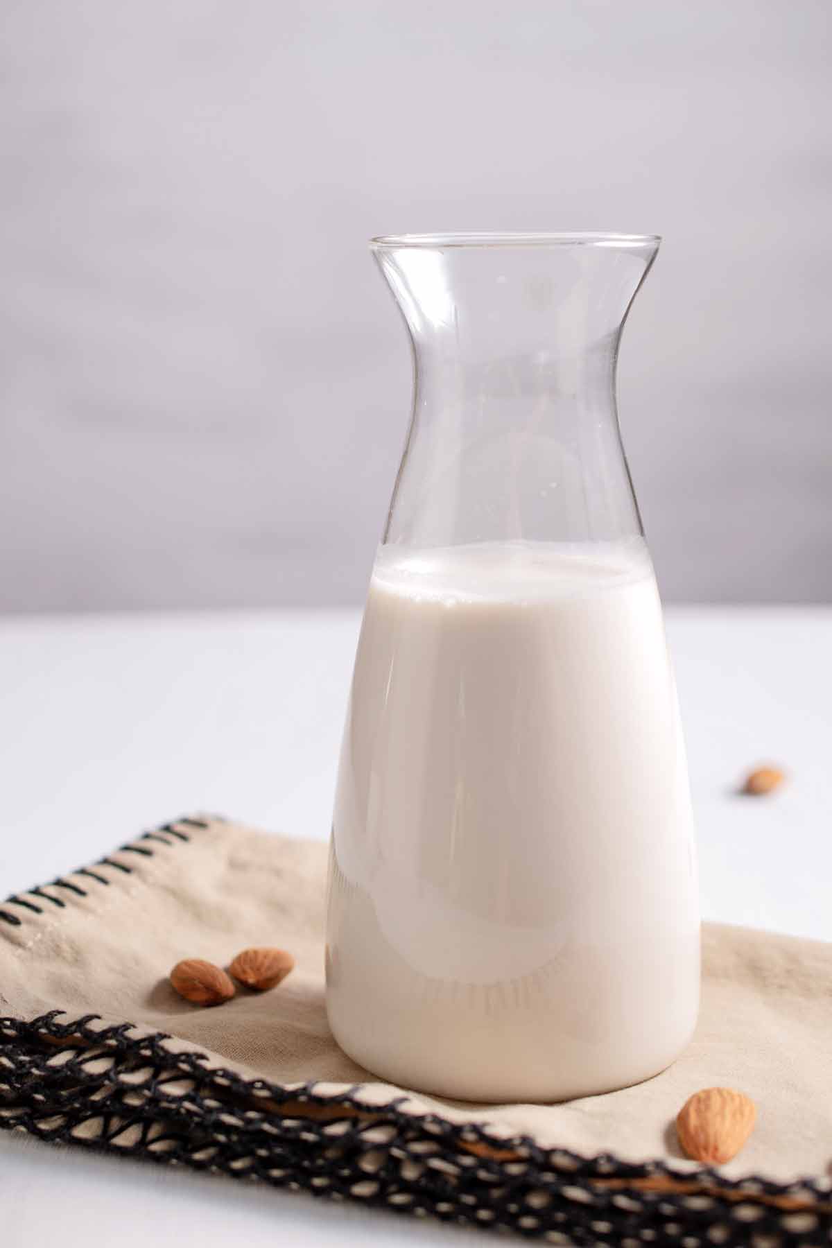 Serving pitcher of almond milk.