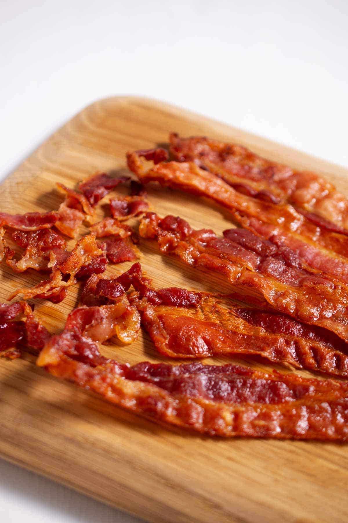 Crispy bacon on a cutting board.