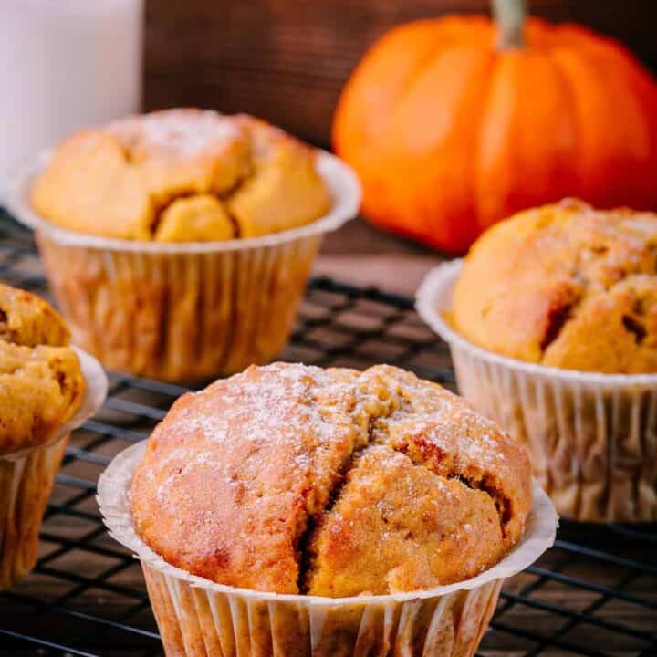 Pumpkin muffins on a baking sheet.