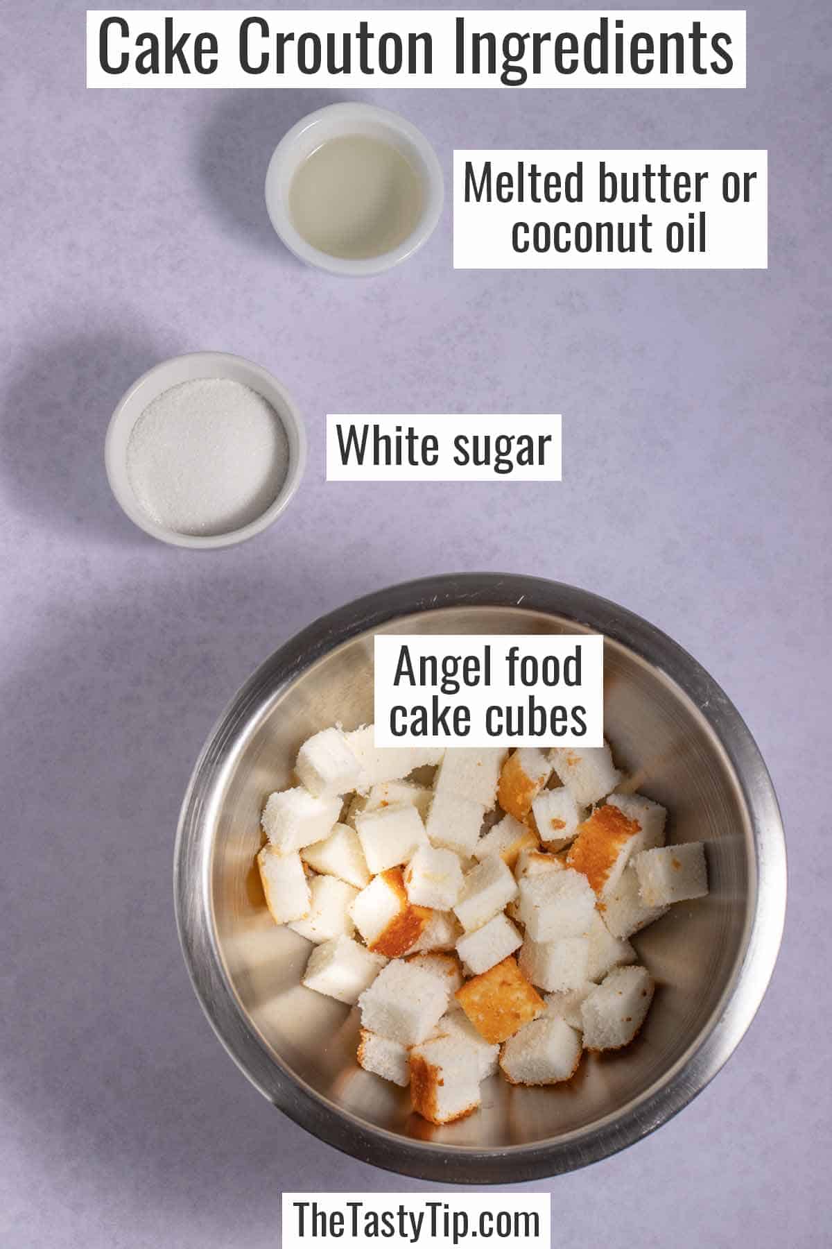 Bowl of melted coconut oil, bowl of white sugar, and bowl of angel food cake cubes. These are the ingredients for angel food cake croutons.