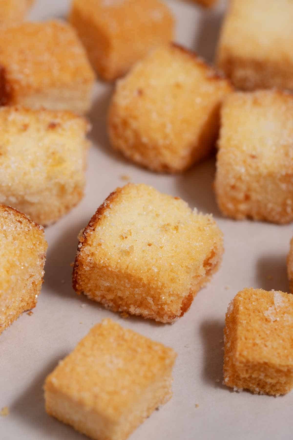 Closeup of angel food cake croutons fresh out of the oven.