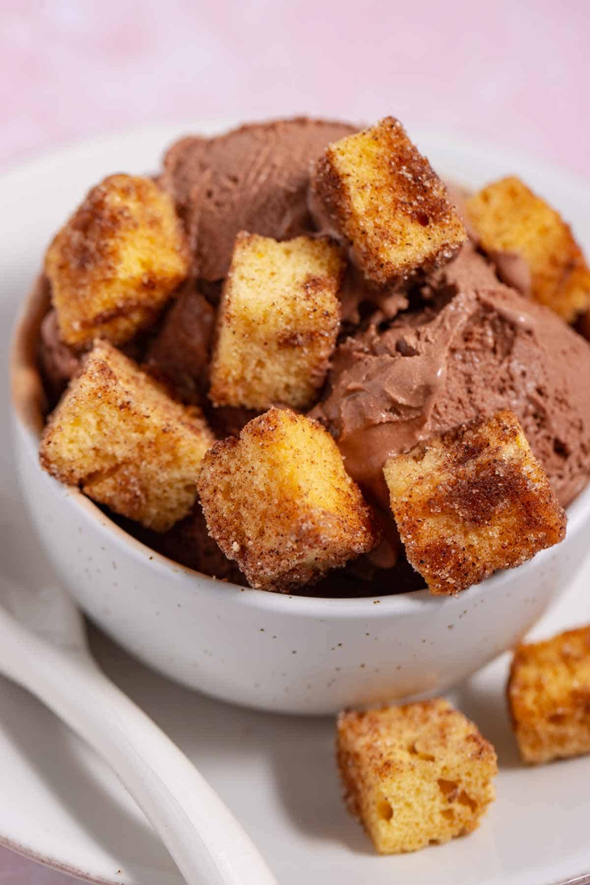 Bowl of chocolate ice cream with cinnamon sugar pound cake croutons.