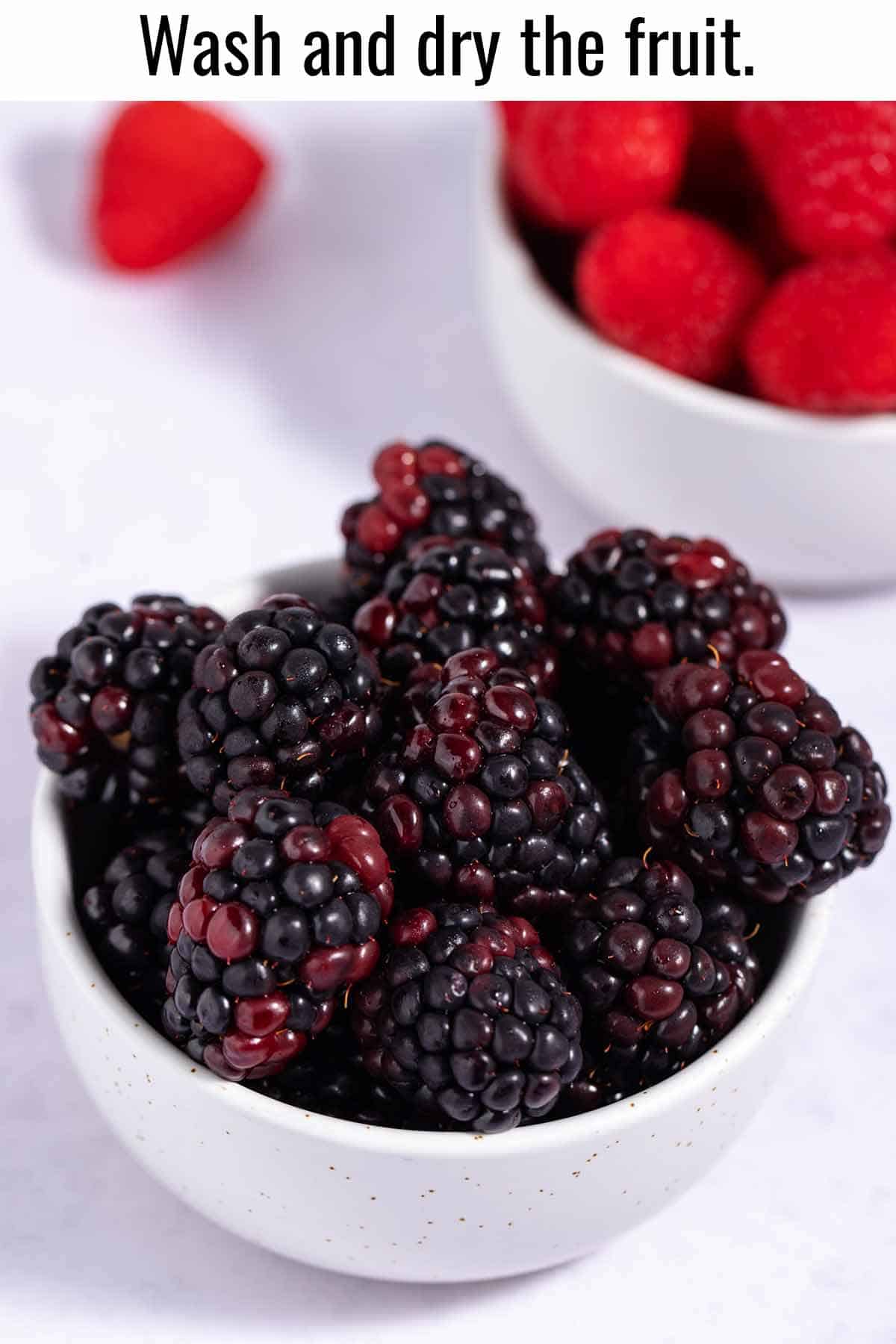 Bowls of boysenberries and raspberries.