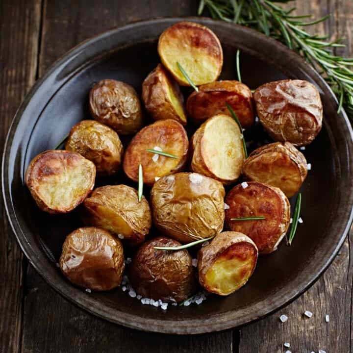 Baked potato halves in a baking dish.