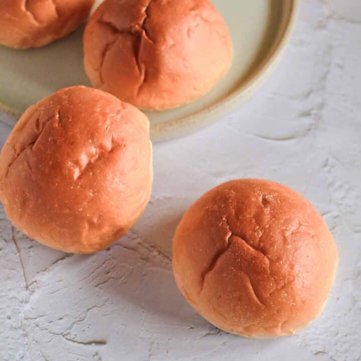 Whole wheat buns on a plate.
