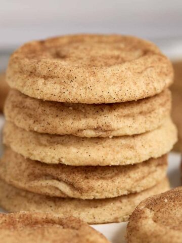 Stack of thick, fluffy snickerdoodle cookies.