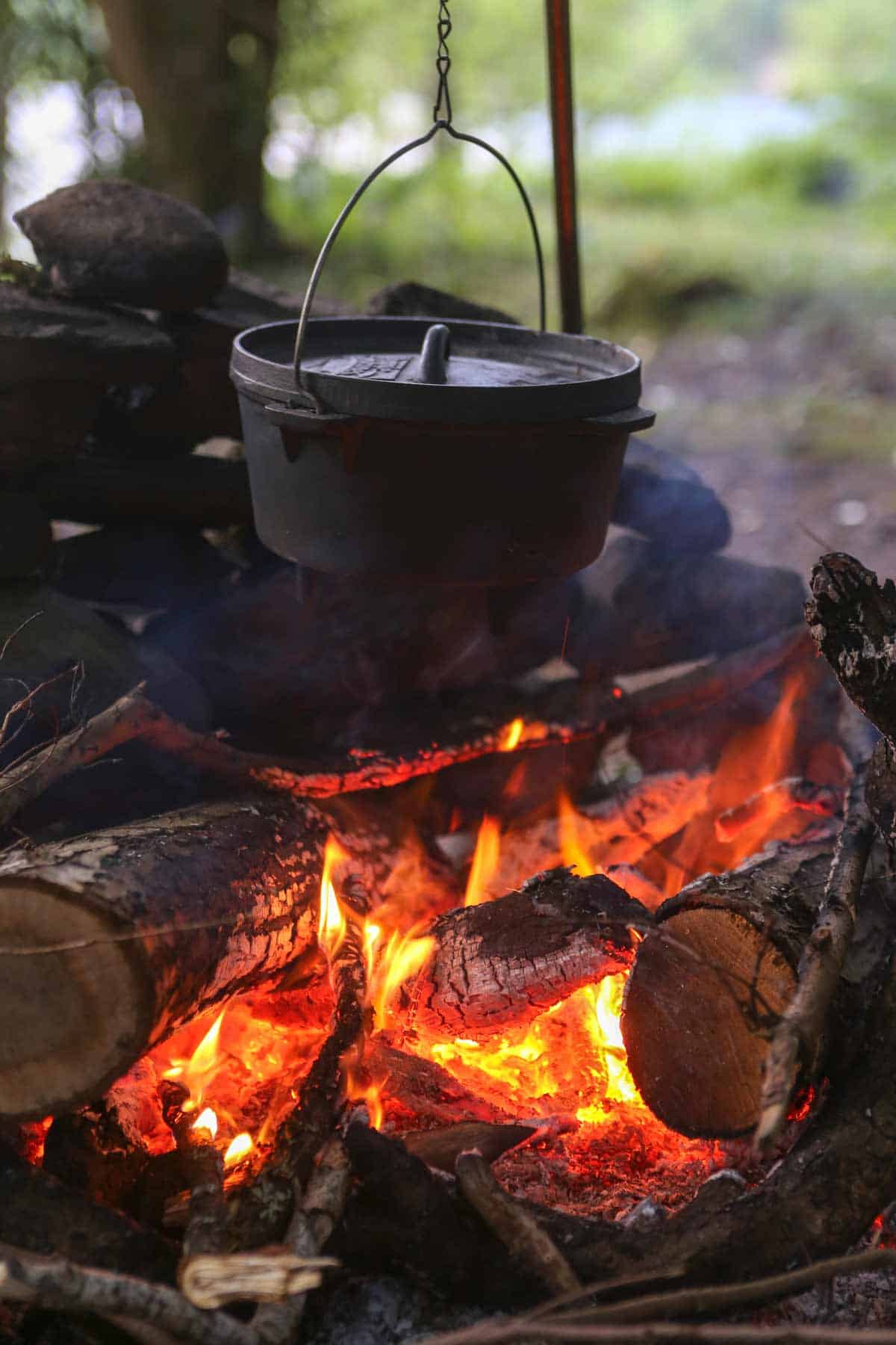 Dutch oven cooking over an open fire.