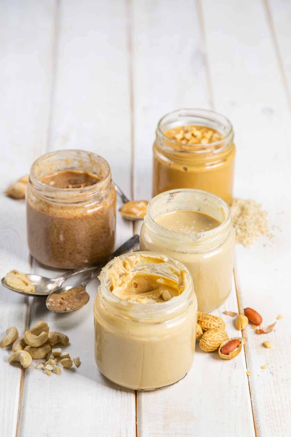 Four jars of nut butter, including cashew butter.