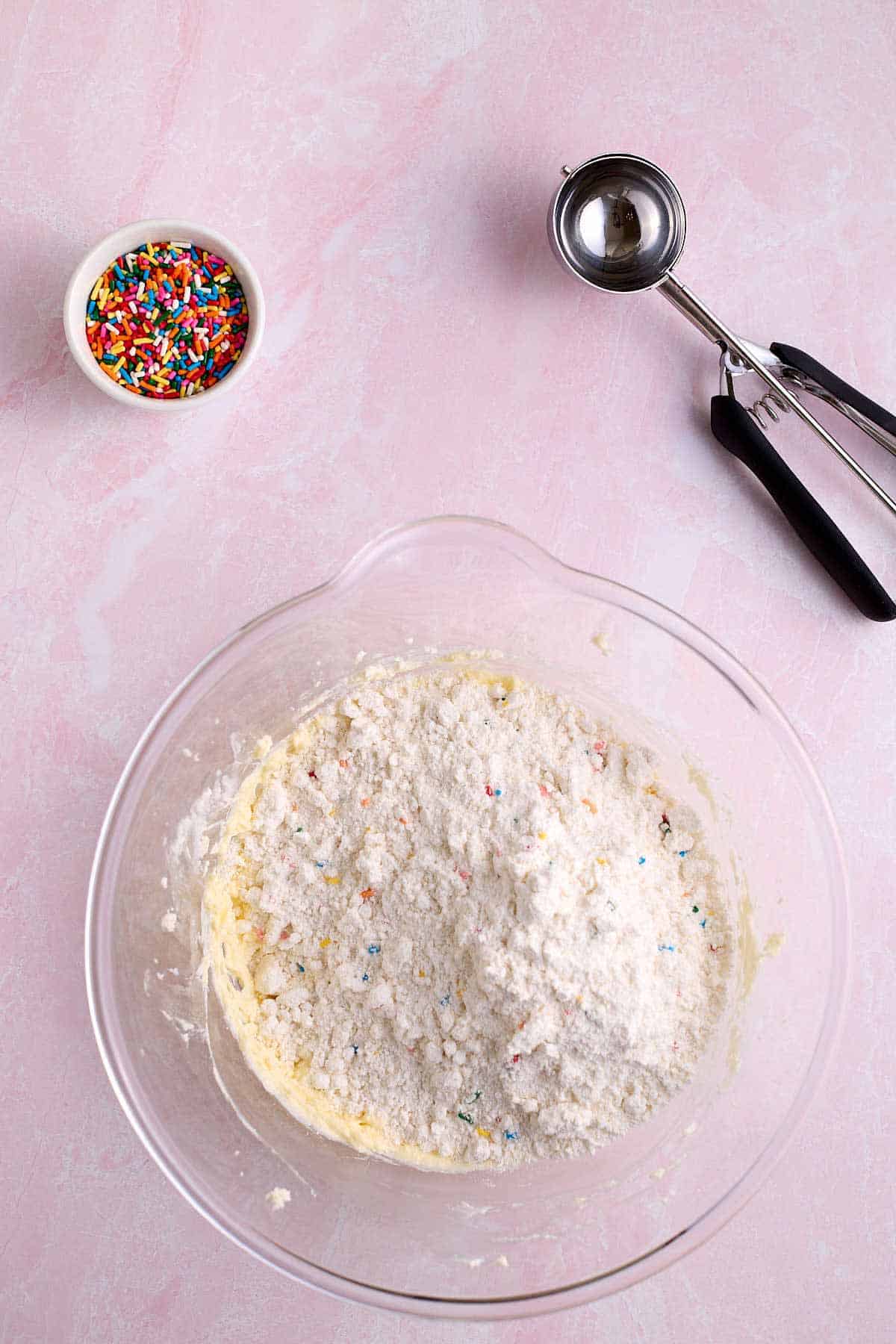 Bowl of funfetti cookies with the cake mix added.