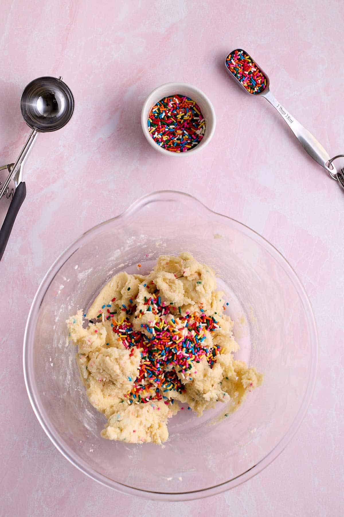 Funfetti cake mix cookie dough with more sprinkles added.
