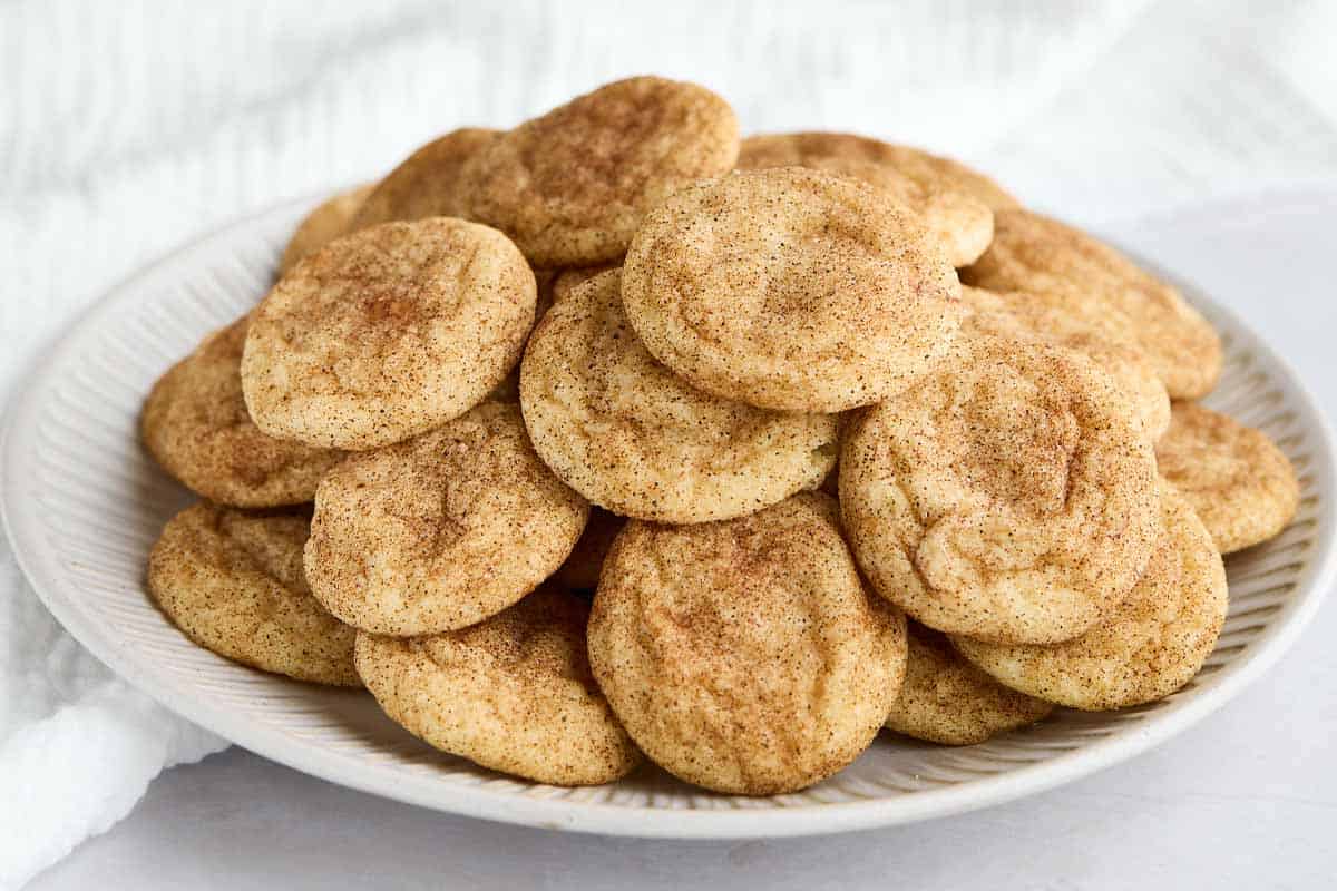 A serving plate piled high with mini snickerdoodles.