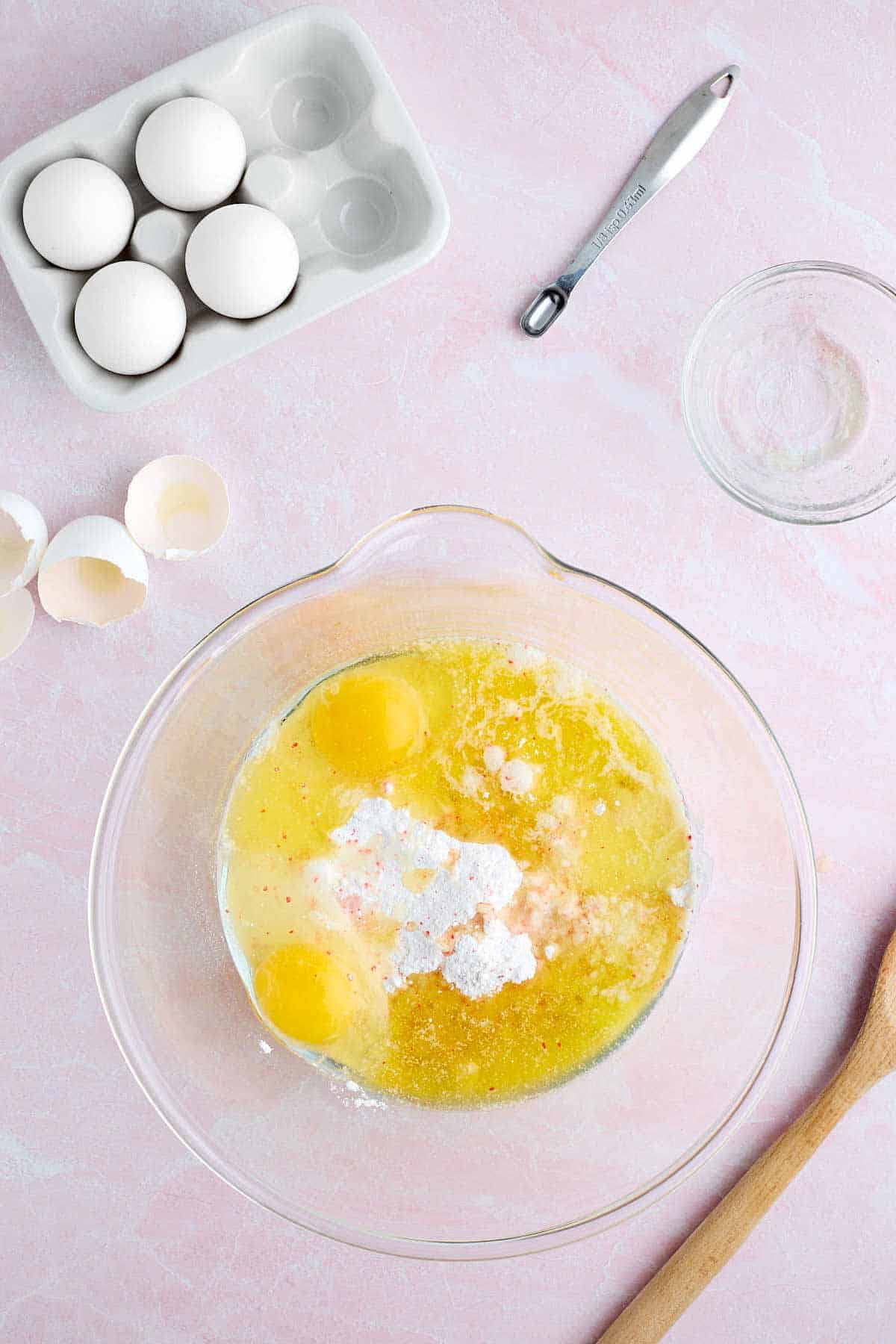 Cake mix, melted butter, eggs, and almond extract in a large mixing bowl.