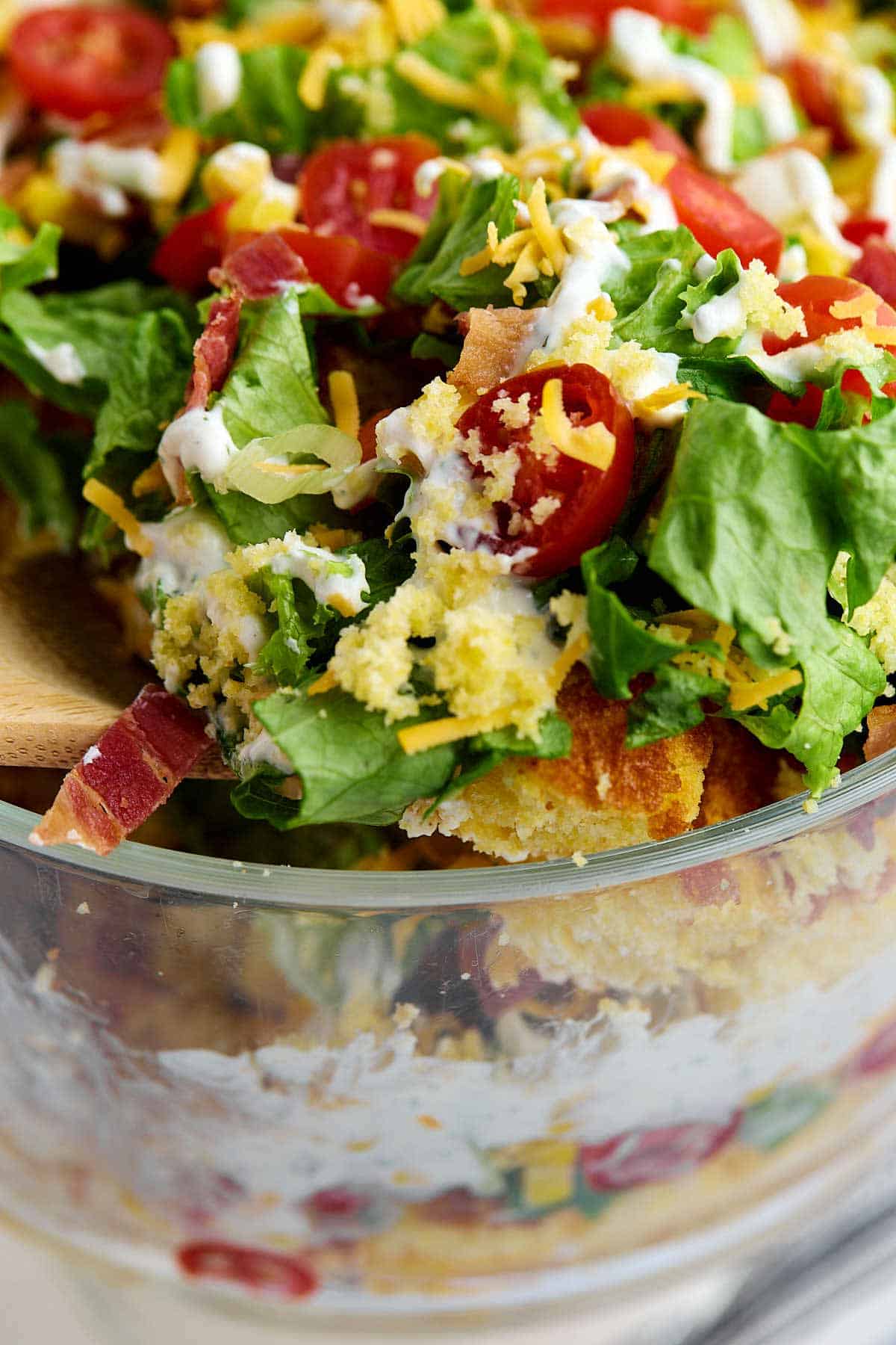 Closeup of a scoop of cornbread salad.