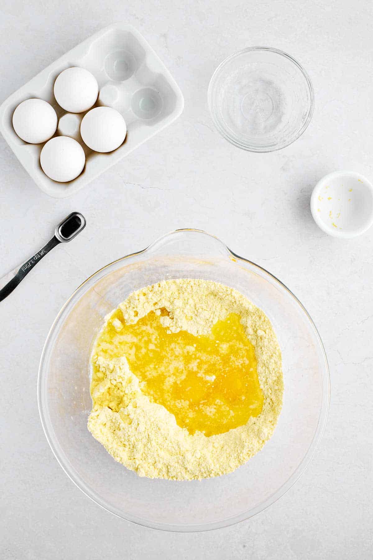Melted butter and eggs poured into the cake mix.