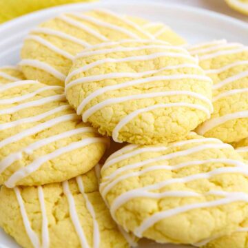 Pile of lemon cake mix cookies on a plate.
