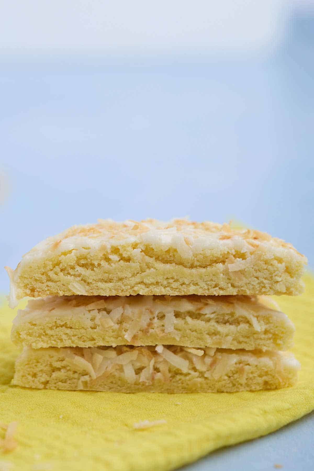 Cut pineapple cookies stacked on top of each other to show the gooey inside.