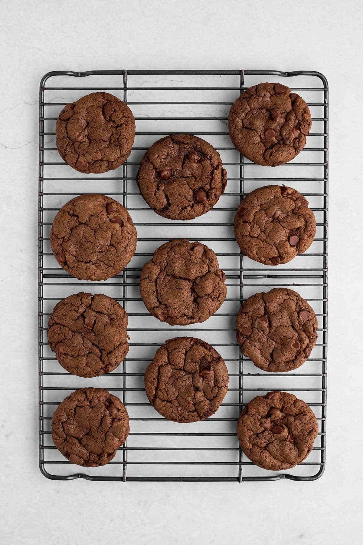 Baked devil's food cake mix cookies on a cooling rack.