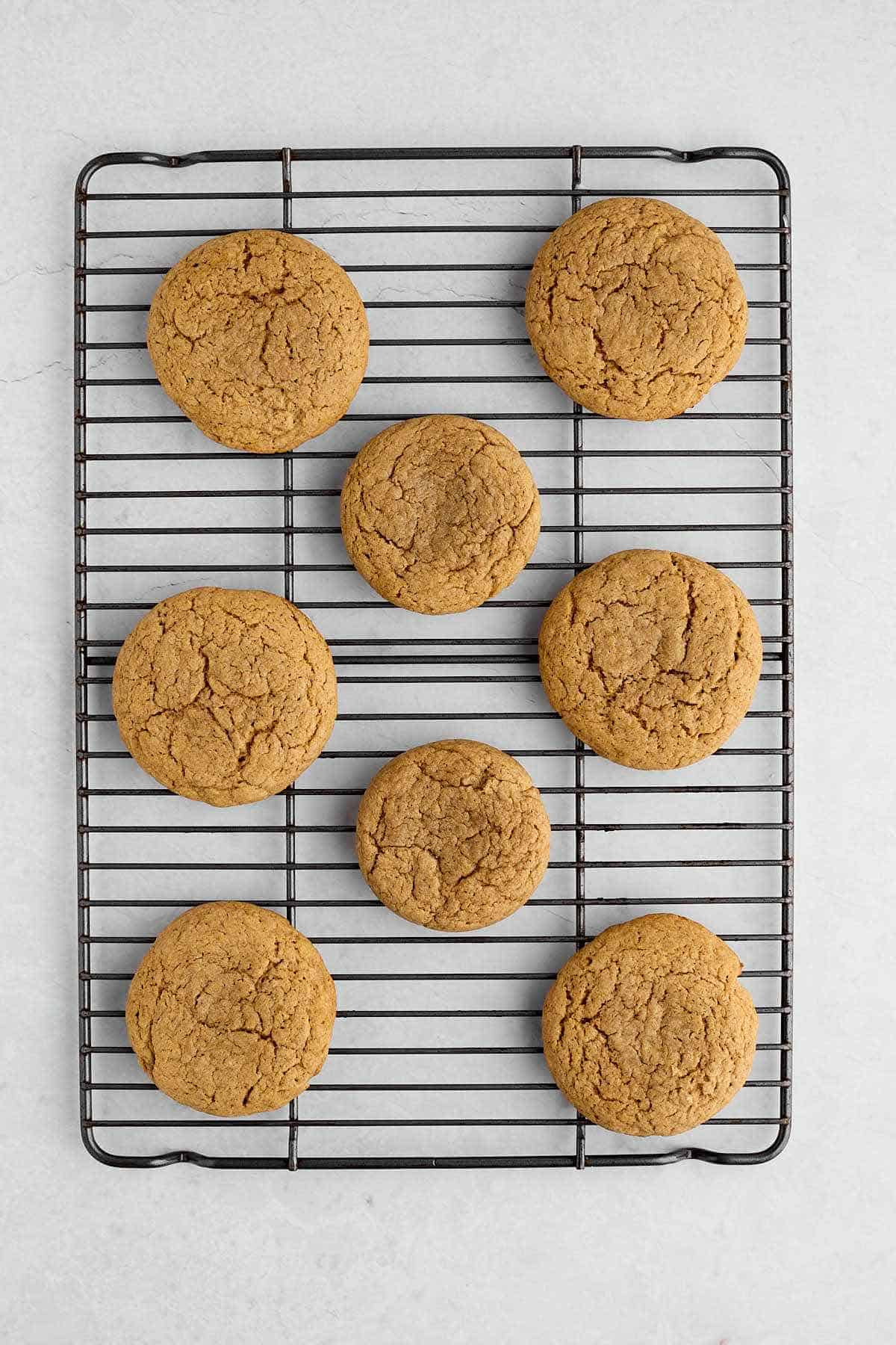 Spice cake mix cookies cooling on a wire rack.