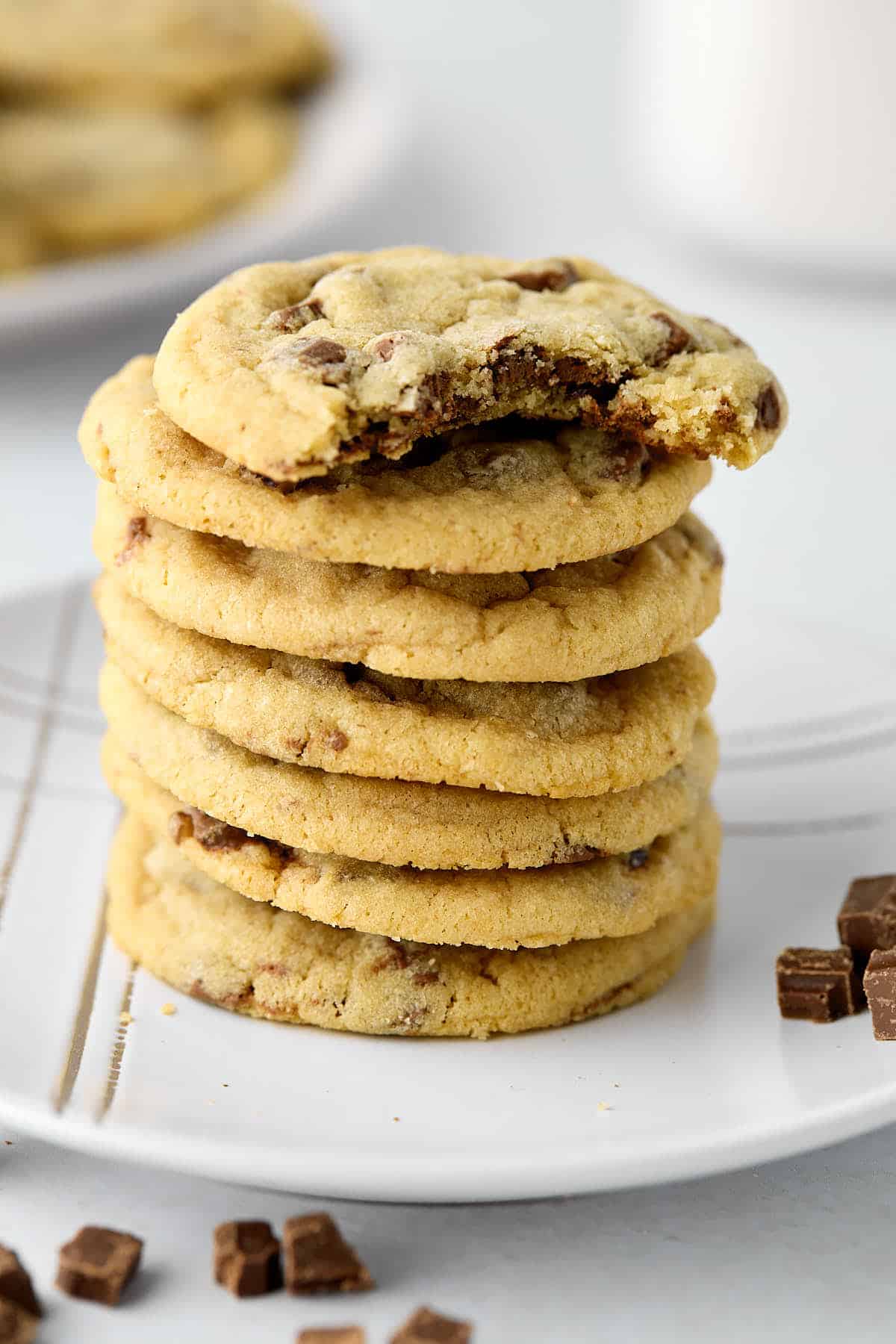 Stack of Hershey bar cookies with a bite taken out of the top cookies.