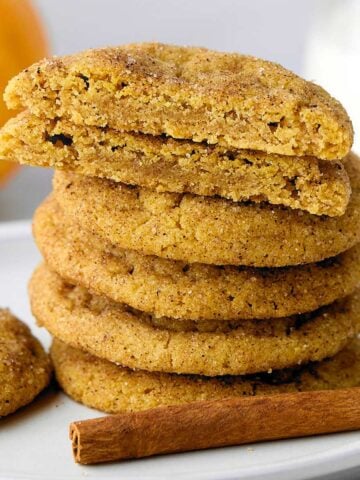 Stack of chewy pumpkin snickerdoodles on a plate.